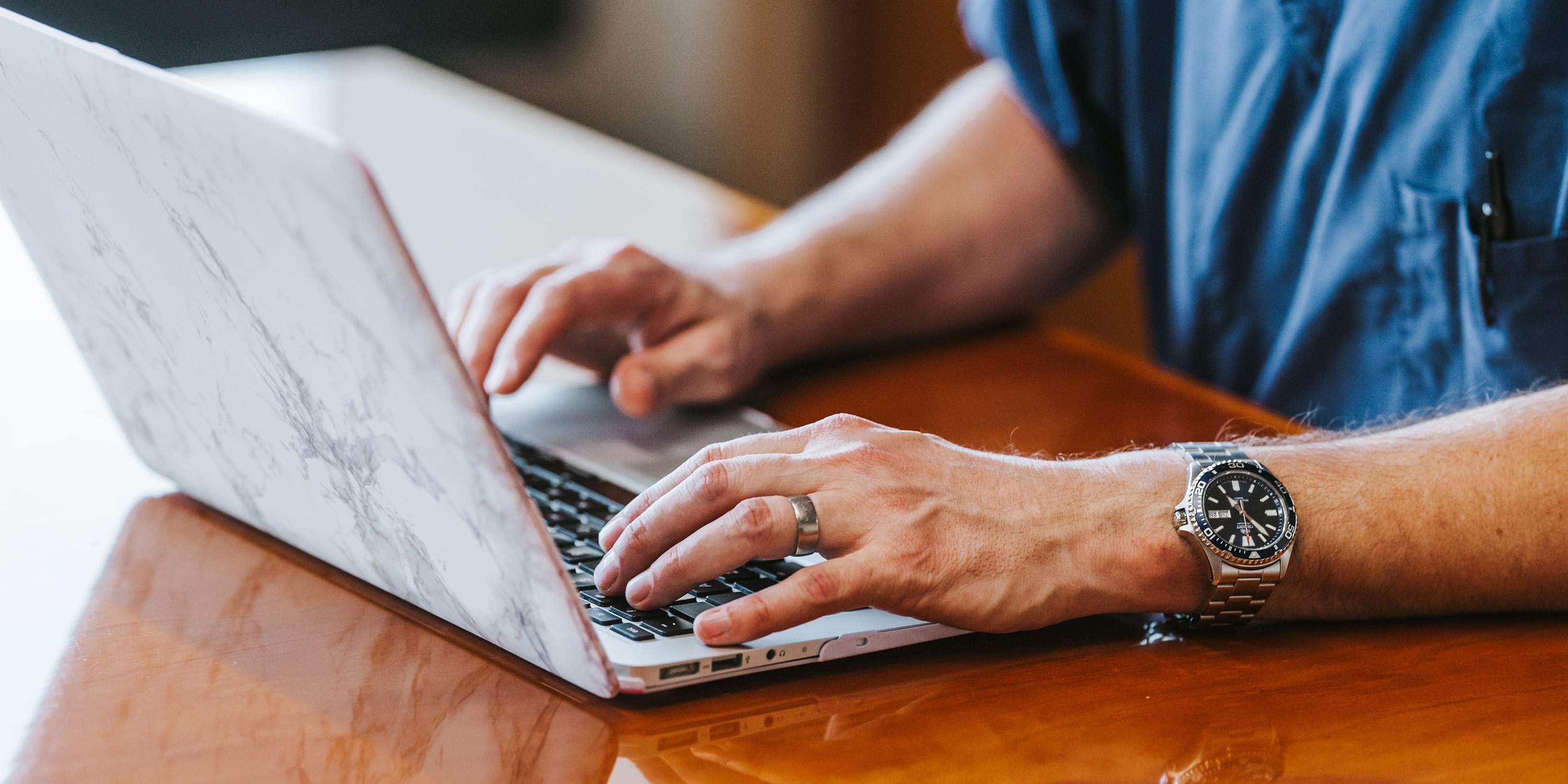 greeley wealth management disclosures featured image of typing on laptop on desk