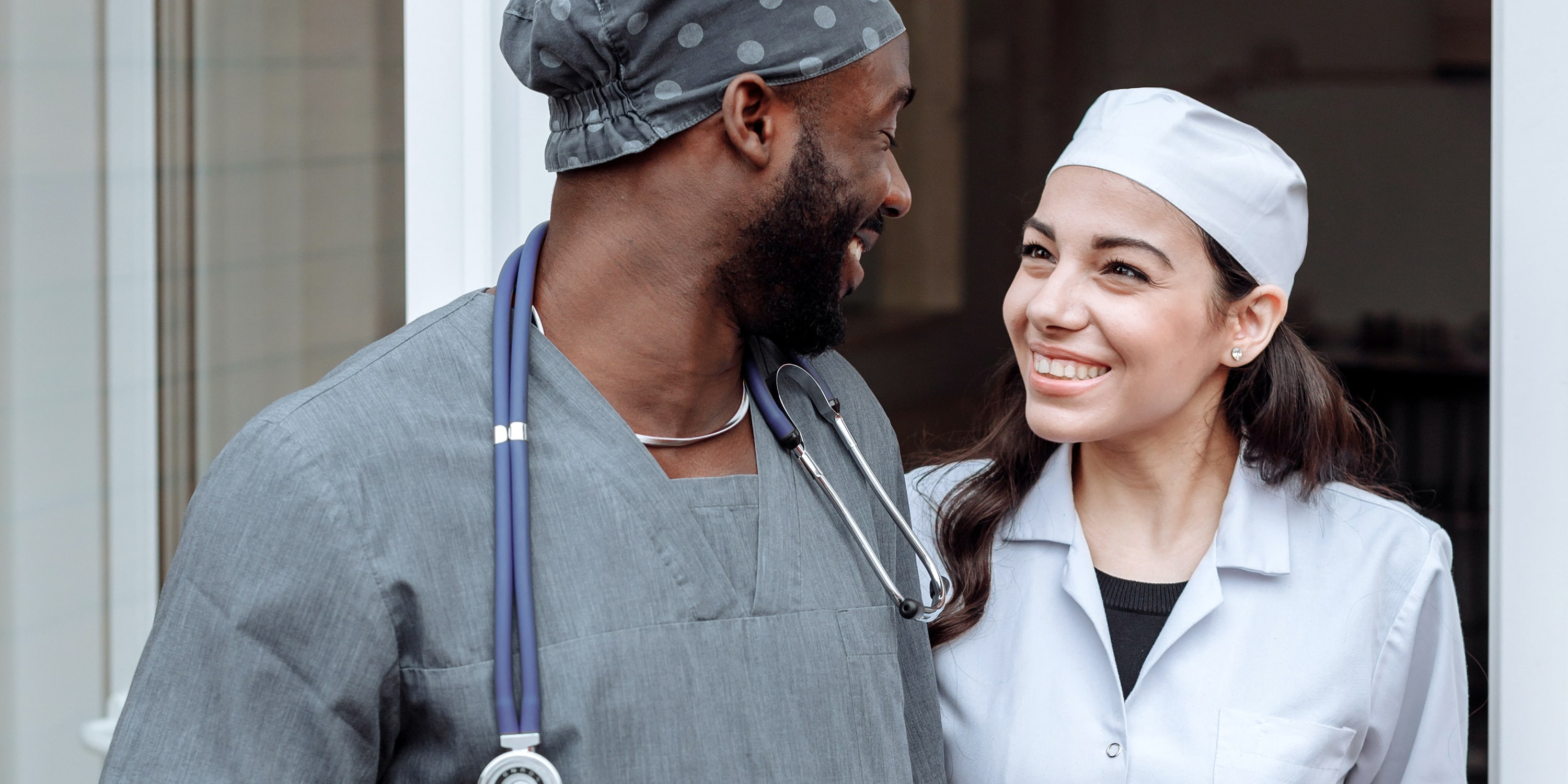 image of male and female surgeons chatting