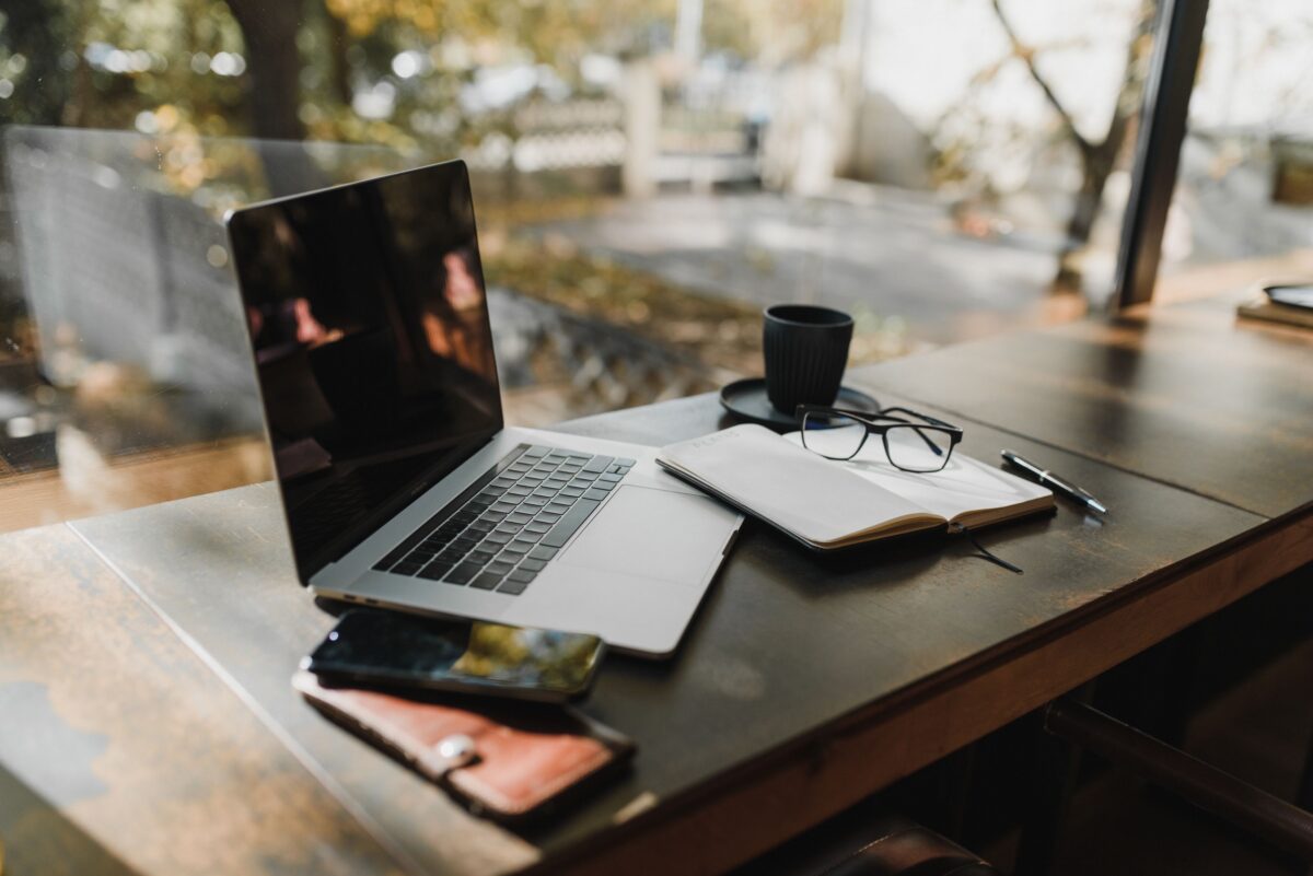 Notebook, coffee, representing financial independence, intentional living, and an ideal lifestyle